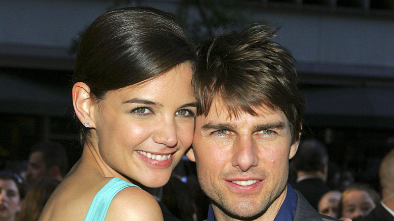 Katie Holmes cuddling Tom Cruise