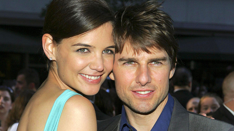 Katie Holmes cuddling Tom Cruise