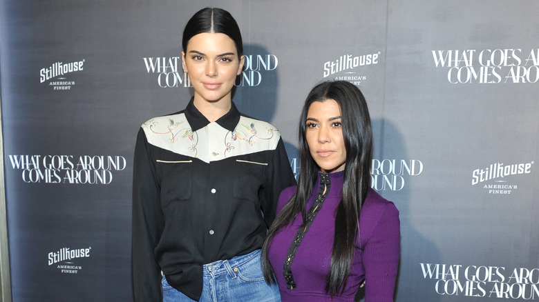 Kendall Jenner with Kourtney Kardashian at event