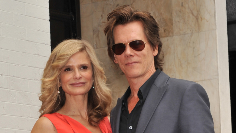 Kyra Sedgwick and Kevin Bacon posing