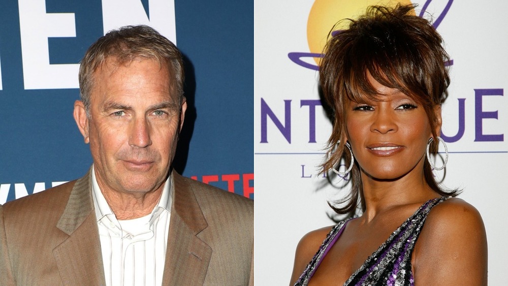 Kevin Costner and Whitney Houston posing on the red carpet