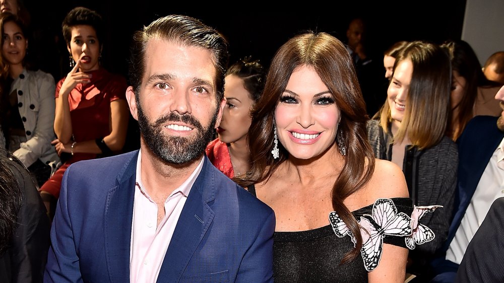 Donald Trump Jr. sitting next to Kimberly Guilfoyle