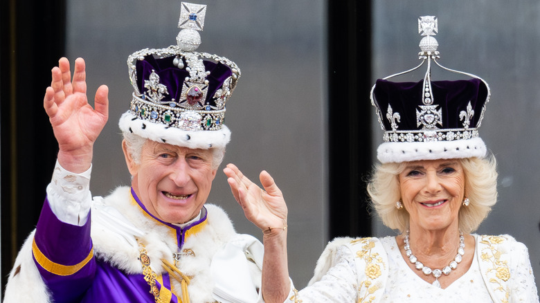 King Charles and Queen Camilla, both waving