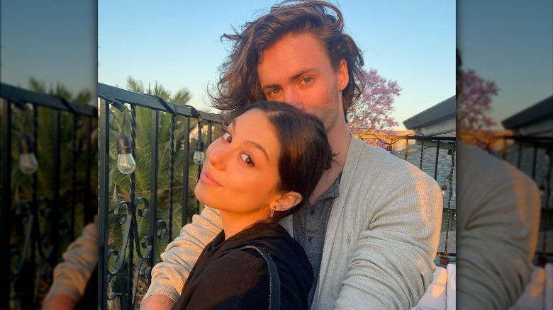 Max Chester with nose in Kira Kosarin's hair