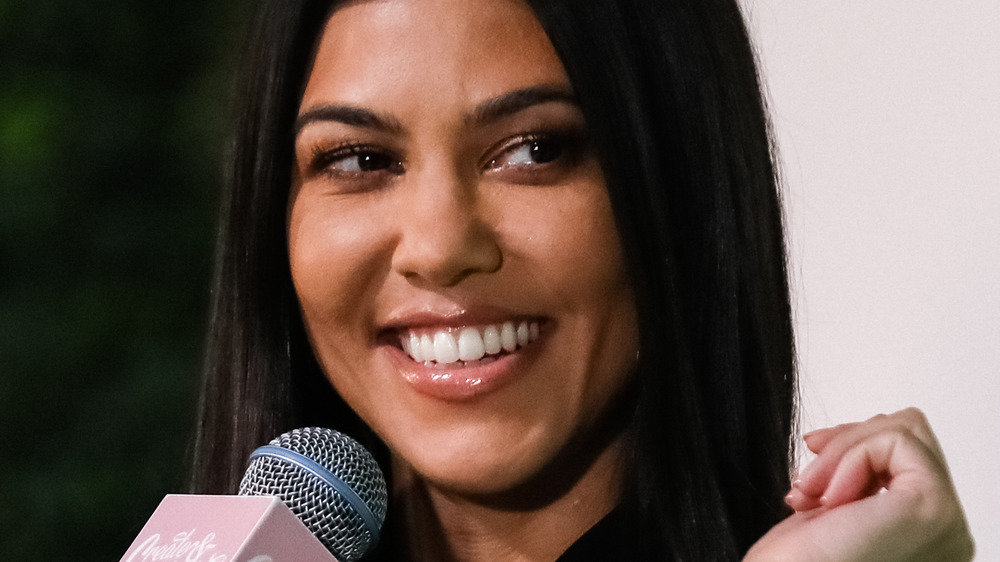 Kourtney Kardashian smiling