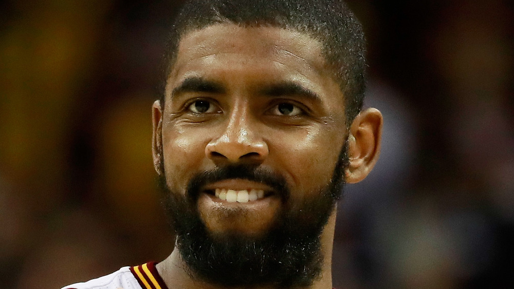 Kyrie Irving playing on the basketball court 