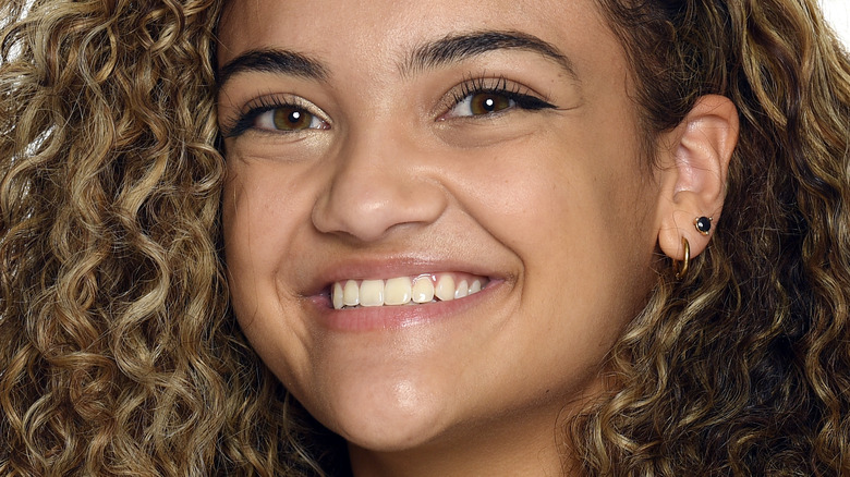 Laurie Hernandez smiling brown curly hair