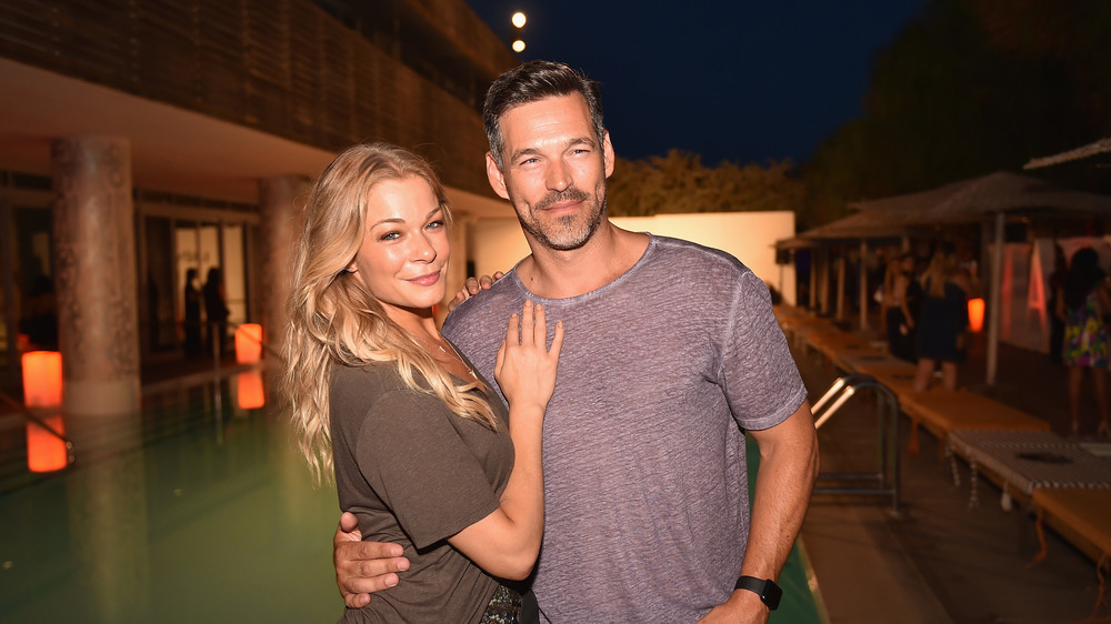 LeAnn Rimes and Eddie Cibrian arm in arm
