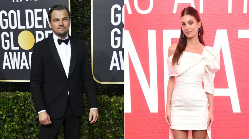 Leonardo DiCaprio and Camila Morrone posing on a red carpet