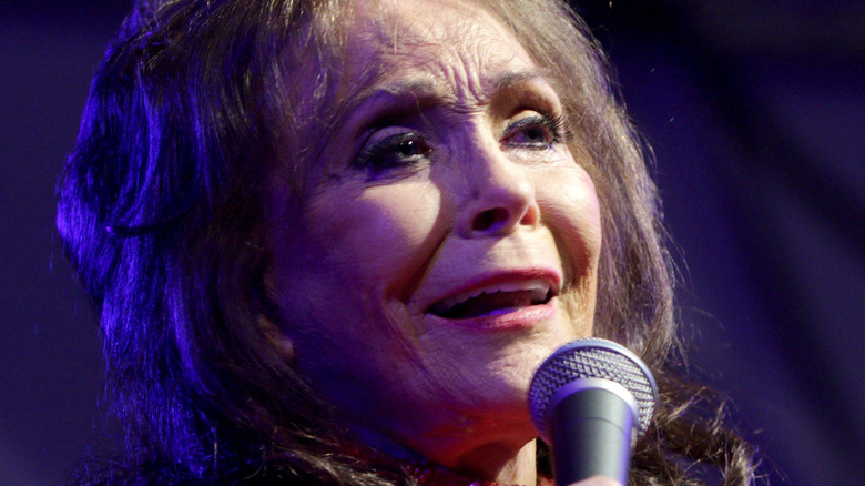 Loretta Lynn singing microphone