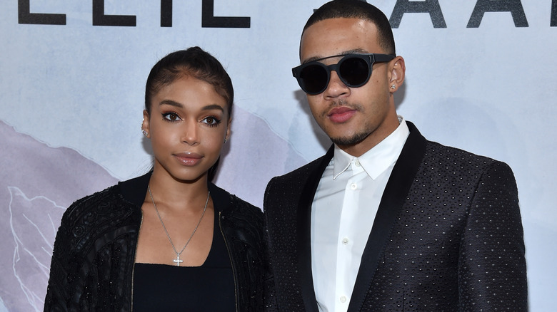 Lori Harvey and Memphis Depay on a red carpet