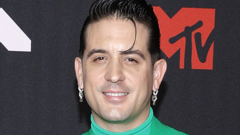 G- Eazy wearing a green blazer