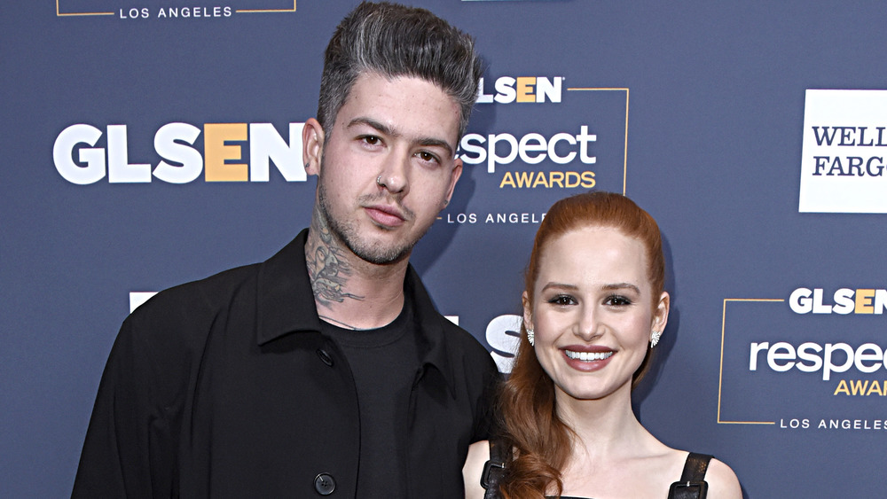 Travis Mills and Madelaine Petsch smiling