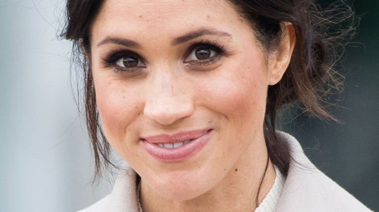 closeup of Meghan Markle smiling at the camera