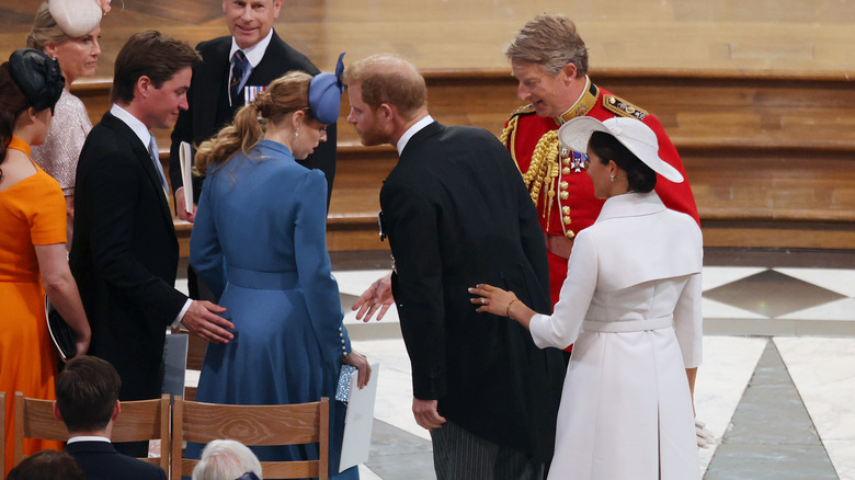 Princess Beatrice, Prince Harry, Meghan Markle talking