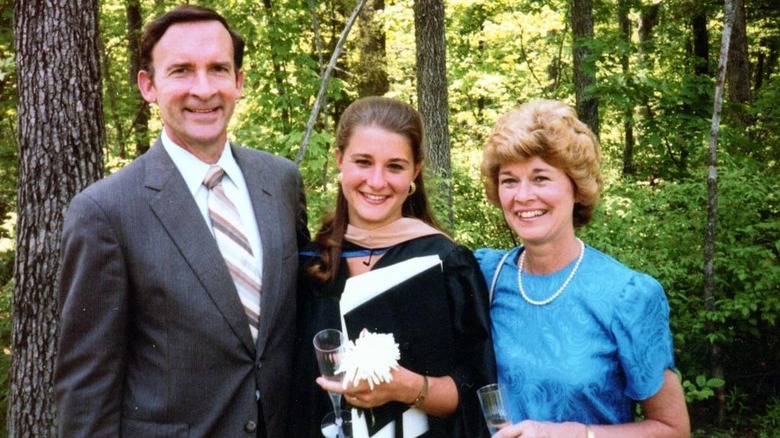 A young Melinda Gates at graduation with her parents