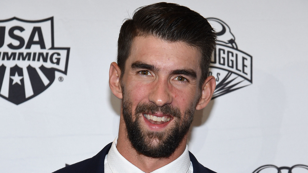 Michael Phelps smiling on the red carpet