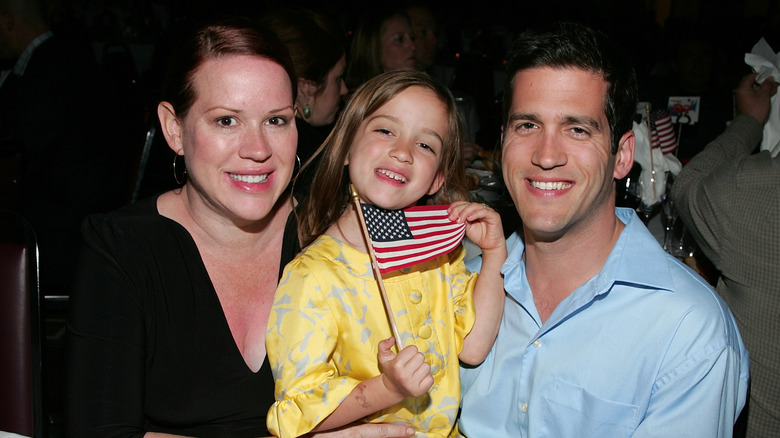 Molly Ringwald poses with Panio Gianopoulos and their daughter Mathilda in 2009,