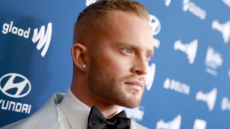 August Getty on red carpet, posing