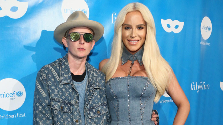 Nats Getty and Gigi Gorgeous, arm in arm, posing