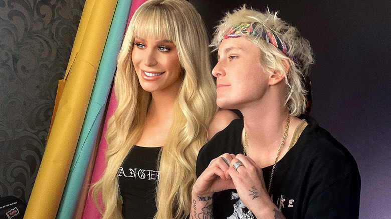 Gigi Gorgeous and Nats Getty posing for cameras