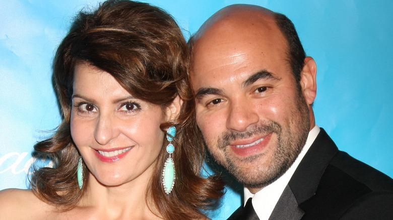 Nia Vardalos and Ian Gomez smiling on the red carpet