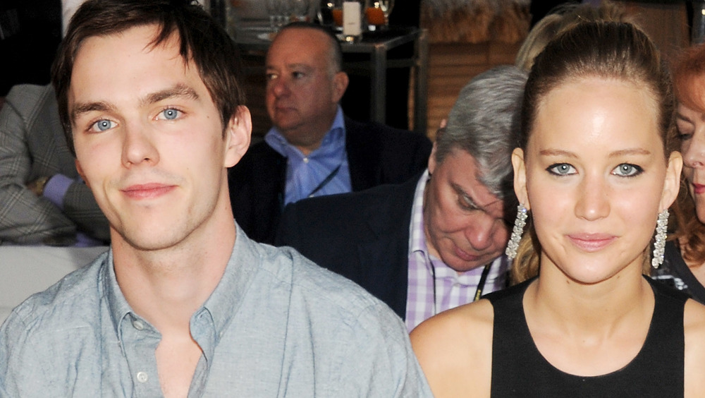 Nicholas Hoult and Jennifer Lawrence sit together in 2012
