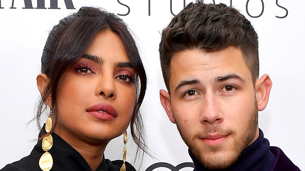 Priyanka Chopra and Nick Jonas pose at a Vanity Fair party