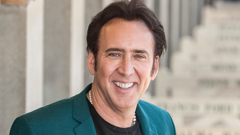 Nicolas Cage smiling for the cameras