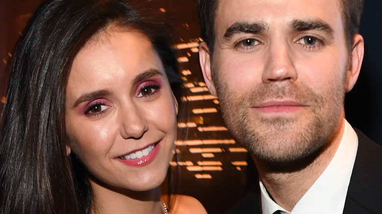 Nina Dobrev and Paul Wesley pose in 2020