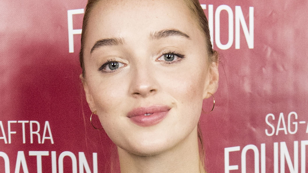 Phoebe Dynevor posing at an event