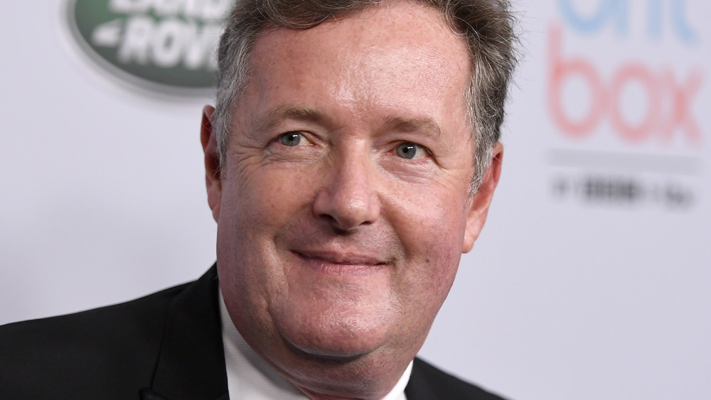 Piers Morgan posing on the red carpet