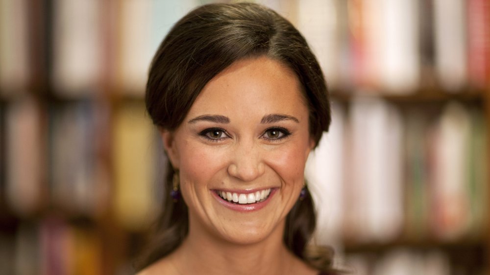 Pippa Middleton smiling while looking straight at camera