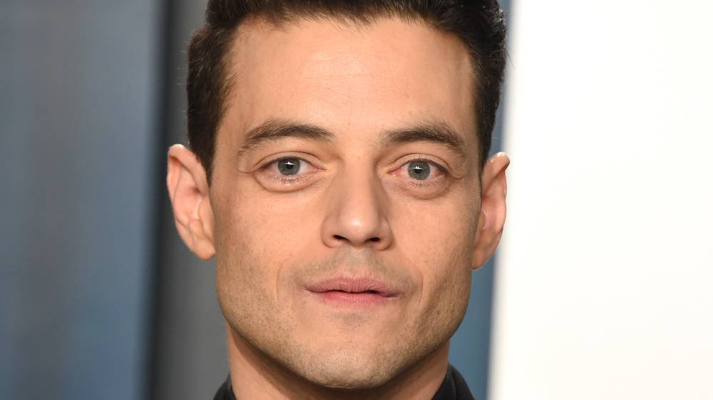 Rami Malek posing at an event