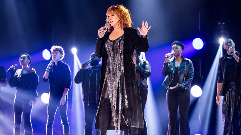 Reba McEntire performing on stage