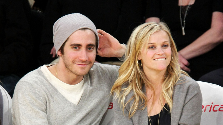 Jake Gyllenhaal and Reese Witherspoon at a basketball game