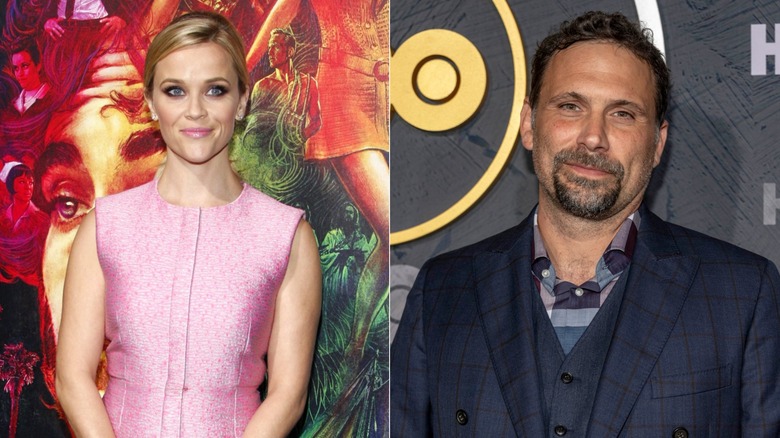 Reese Witherspoon Wearing a pink sleeveless dress and Jeremy Sisto wearing a blue striped suit and striped tie