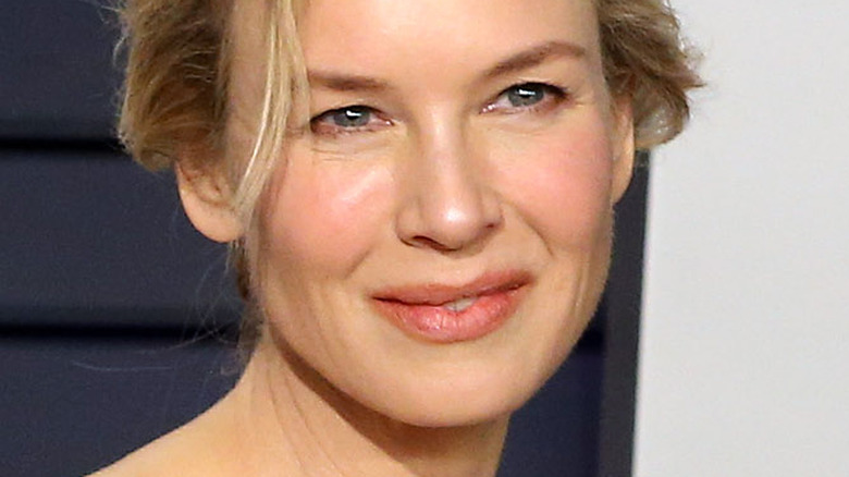 Renee Zellweger smiling and looking to the side