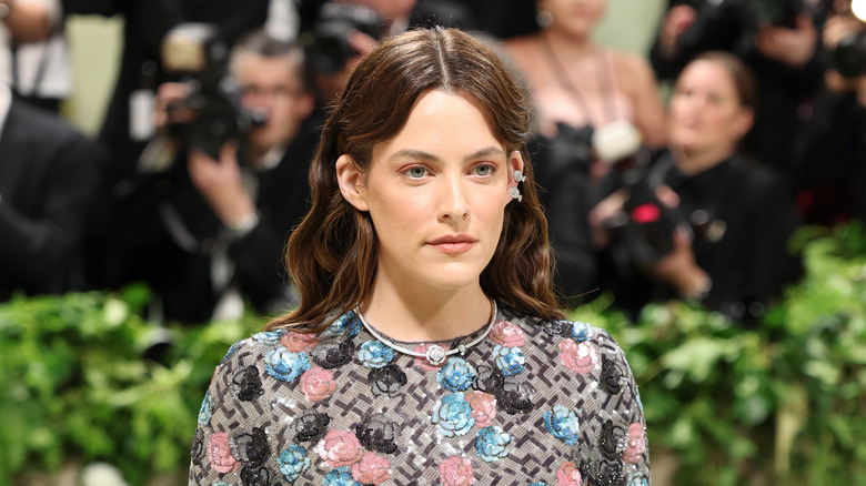Riley Keough with hair behind ears