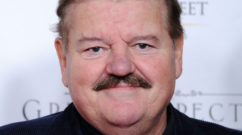 Robbie Coltrane smiling in a photo