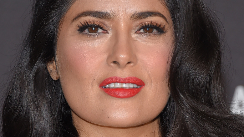 Salma Hayek slightly smiling and looking at camera