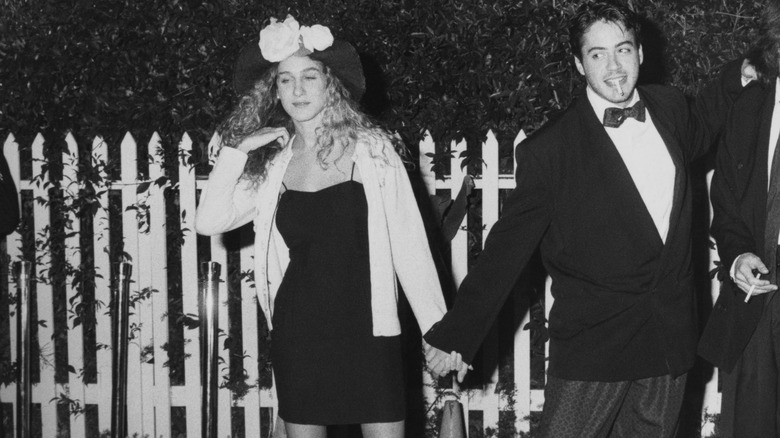 Sarah Jessica Parker and Robert Downey Jr. holding hands
