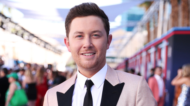 Scotty McCreery grinning at an event