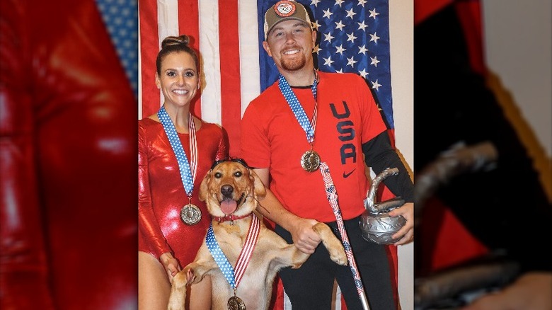 Scotty McCreery in costume with wife Gabi and pet dog