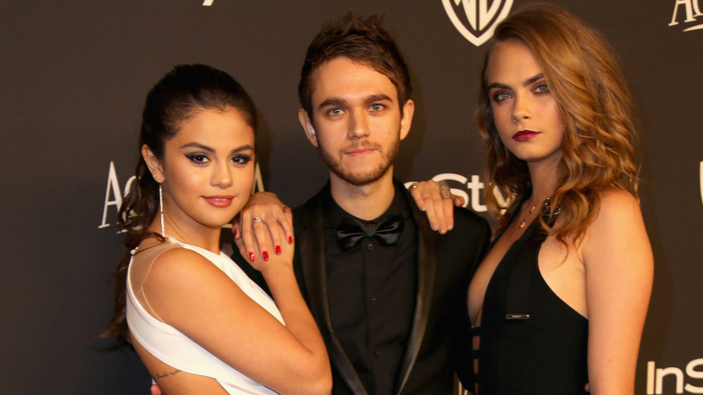 Selena Gomez poses with Zedd and Cara Delevigne