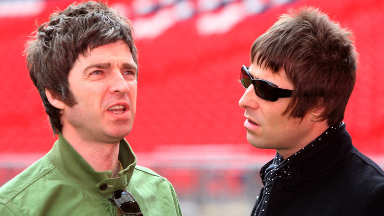 Noel Gallagher and Liam Gallagher looking irritated