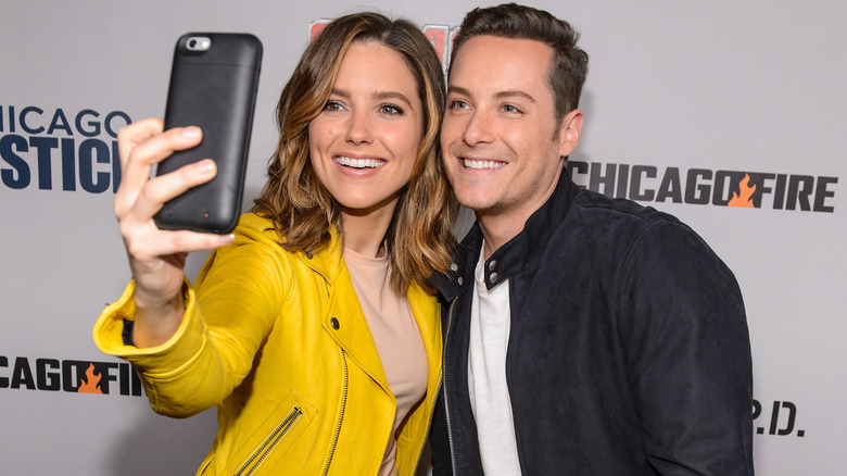 Sophia Bush and Jesse Lee Soffer taking a selfie together