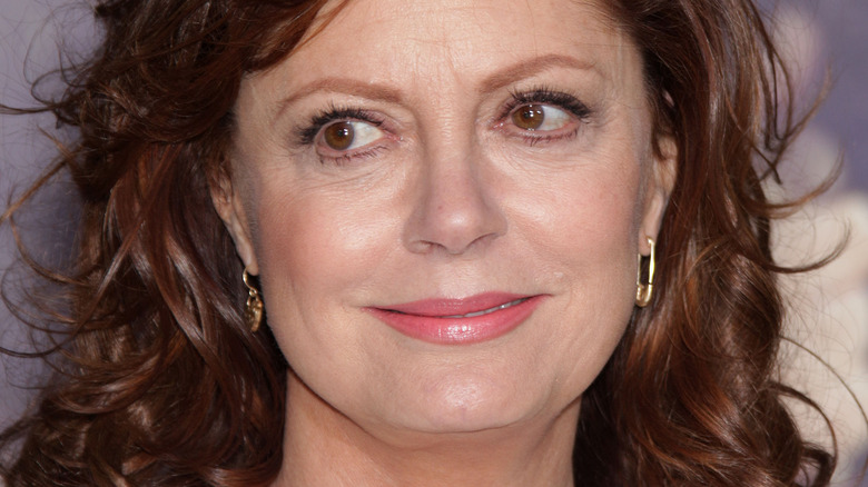 Susan Sarandon poses in gold earrings