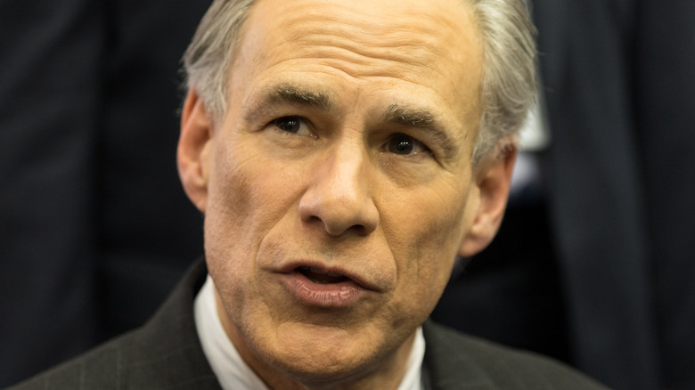 Texas Governor Greg Abbott speaks to the media before the Republican National Committee in 2016