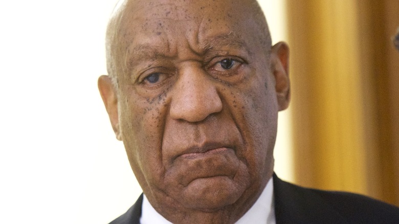 Bill Cosby walking in court